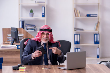 Old arab businessman in the officeの写真素材