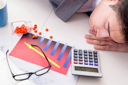 Finance analyst feeling sick due to bad resultsの写真素材