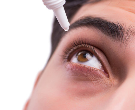 Young man in eye care medical conceptの写真素材