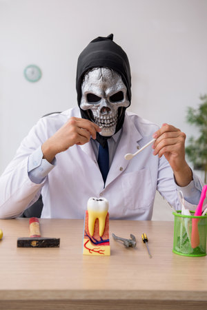 Devil doctor stomatologist working in the clinicの写真素材