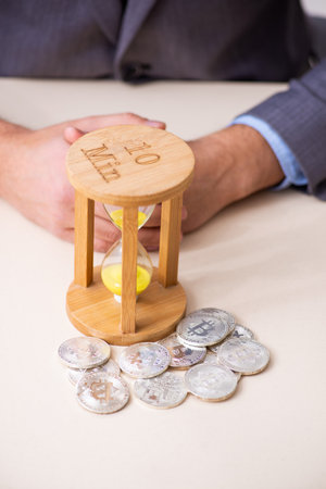 Young man earning money via Internet in time management concept
