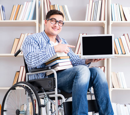Disabled student studying in the libraryの写真素材