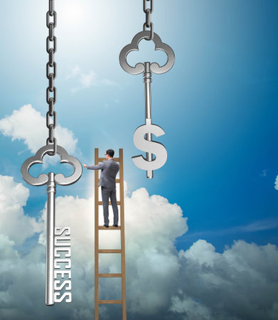 Businessman in key to financial success conceptの写真素材