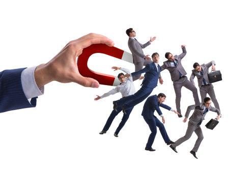 Businessman in recruitment concept with horseshoe magnetの写真素材