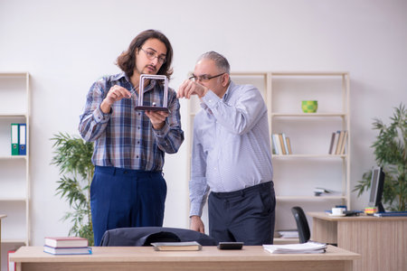 Two employees and meditation balls in the officeの写真素材