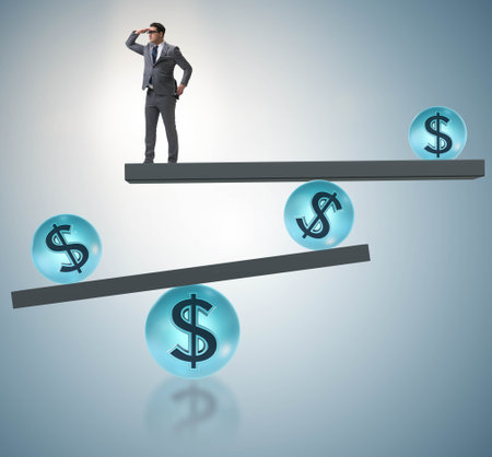 Businessman balancing in financial dollar conceptの写真素材