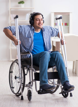 Disabled man listening to music in wheelchair