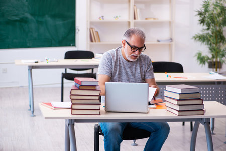 Old male student in tele-education conceptの写真素材