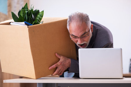 Old male employee being fired from his work