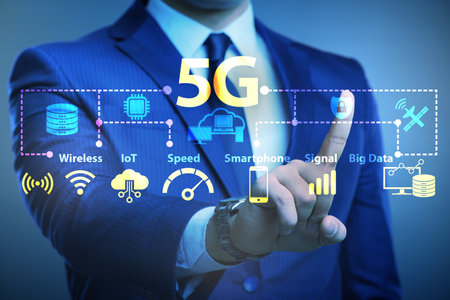 Businessman pressing button in 5g conceptの写真素材