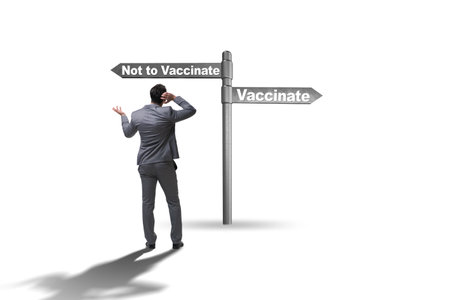 Businessman facing dilemma of vaccinationの写真素材