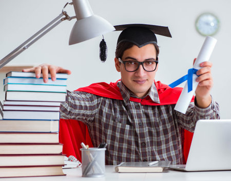 Super hero student with books studying for examsの写真素材