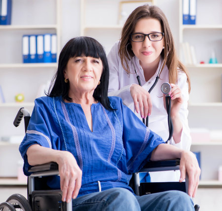 Senior woman visiting doctor for regular check-upの写真素材