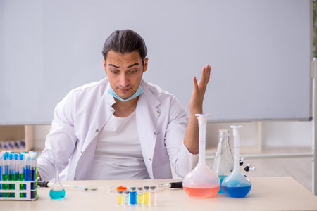 Young male chemist working in the labの写真素材