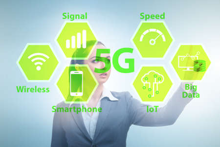 Businesswoman pressing button in 5g conceptの写真素材
