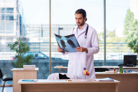 Young male doctor radiologist working in the clinic
