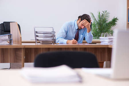 Young male employee working in the officeの写真素材