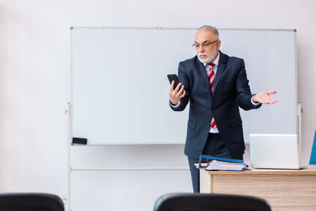 Old male business couch in the classroom during pandemic