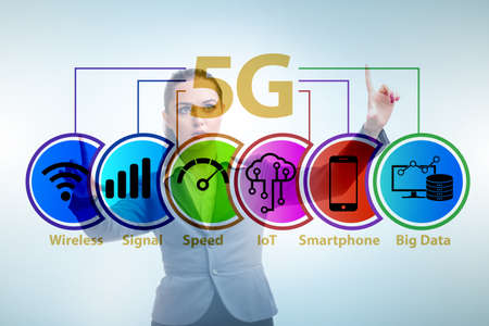 Businesswoman pressing button in 5g concept