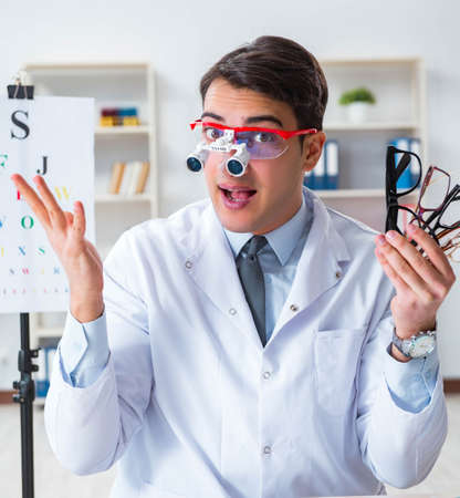 Eye doctor in eyecare concept in hospitalの写真素材
