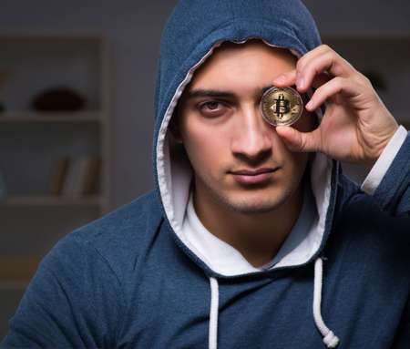 Young man in bitcoin mining conceptの写真素材