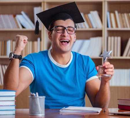 Young man graduating from universityの写真素材