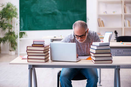 Old male student in tele-education conceptの写真素材