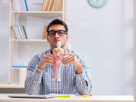 Medical student studying in classroom