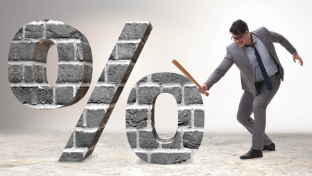 Angry man with baseball bat hitting percentage signの写真素材