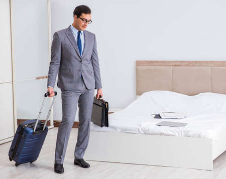 Businessman in the hotel room during travelの写真素材