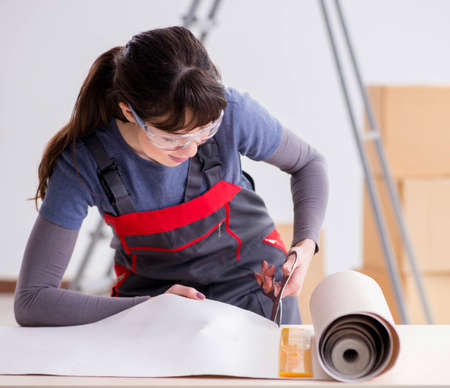 Woman preparing for wallpaper work