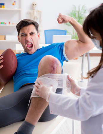 American football player with injury visiting doctorの写真素材