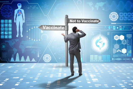 Businessman facing dilemma of vaccinationの写真素材