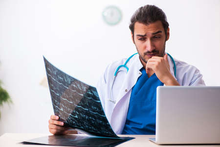 Young male doctor radiologist working in the clinic