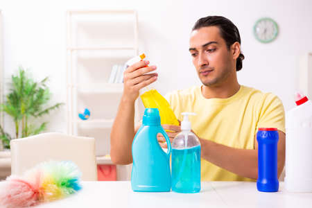 Young male contractor doing housework at homeの写真素材
