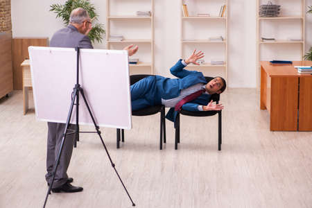 Two male employees in business meeting conceptの写真素材