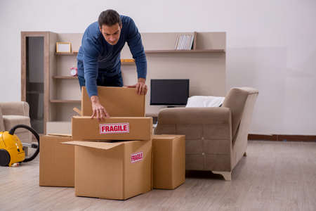 Young man moving to new flat