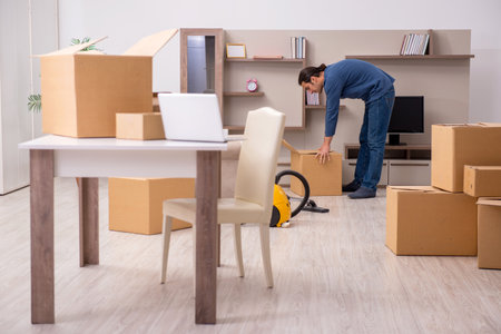 Young man moving to new flatの写真素材