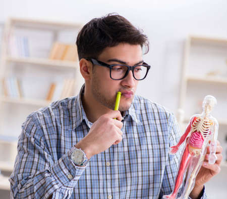 Medical student studying in classroom