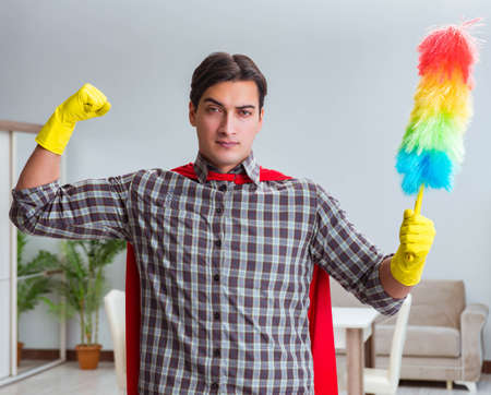 Super hero cleaner working at home