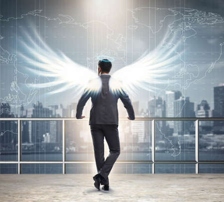 Angel investor concept with businessman with wingsの写真素材