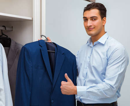 Businessman dressing up for workの写真素材
