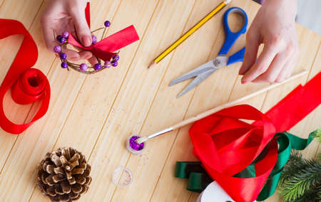 Woman doiing DIY festive decorations at home