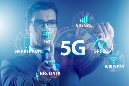 Businessman pressing button in 5g conceptの写真素材