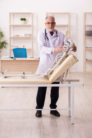 Dead patient visiting old male doctorの写真素材