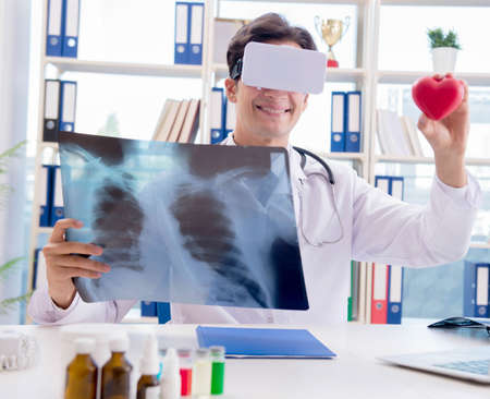 Doctor working with virtual VR reality glassesの写真素材