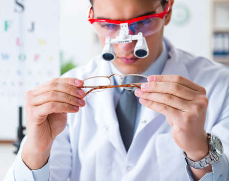 Eye doctor in eyecare concept in hospitalの写真素材