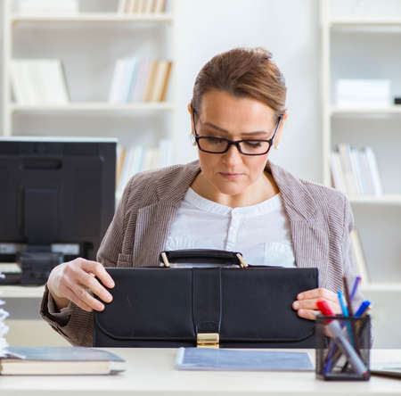 Businesswoman very busy with ongoing paperworkの写真素材