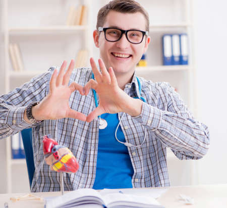 Medical student studying heart in classroom during lectureの写真素材
