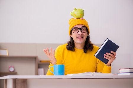 Young male student preparing for exams at homeの写真素材